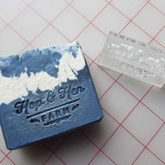 clear acrylic soap stamp and picture of soap with impression