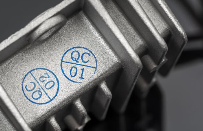 2x4 Wood Handle Rubber Stamp on canvas with black stamped impression of 